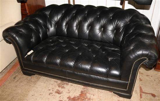 A black leather Chesterfield